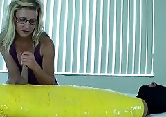 White girl with long hair strokes dudes cock and talks