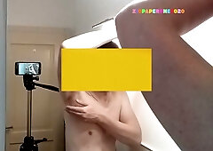 Man shaves chest and underarms on camera while listening to jazz
