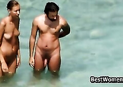 Bare honey is sucking a goth hard wang on the nudist beach, during the day