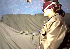 Mature Pakistani woman in green jacket gives blindfolded oral in dim room