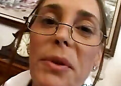 Nerdy mature is sucking a big, black dick and taking it deep down her throat, as much as she can