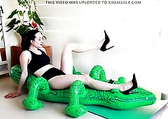 Yoga and Stilettos Destroy the Inflatable Crocodile