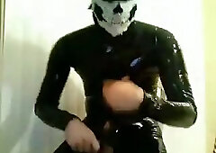 Awful Stud In Black Latex Suit