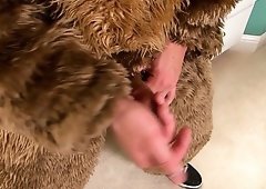 Young stud takes his dick out of that costume and slowly plays with it