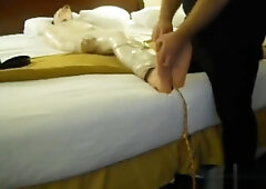 Tickled wrapped tied on bed
