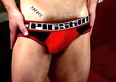 Athletic stud tugging his cock in solo