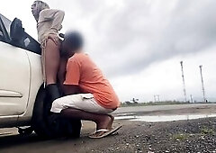 SCREWING ON THE SIDE OF A BUSY ROAD