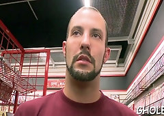 Fellating faggot knob in a gloryhole