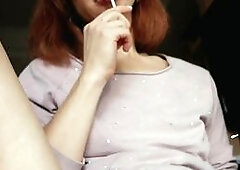 A beautiful babe indulges in some solo play, teasing her pussy with a lollipop before switching to her fingers, bringing herself to a shuddering orgas