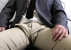 Asian dude doing some rotating edging in slick business clothes