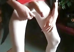 Crossdressing shemale teases with her massive schlong and jerks off