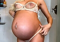 Worshipping the big belly of a pregnant taboo blonde in a steamy JOI session