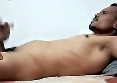 massaging the twink's black cock until he spurts cum
