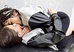 Sultry young lesbians share a passionate kiss