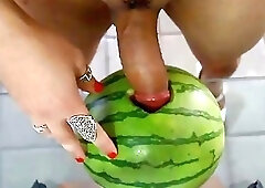 Kinky dildo sucking crossdresser sticks her prick in a watermelon