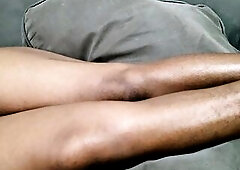 A Woman with Tons of Charming Pubic Hair Between Her Legs Lies on Her Sofa Awaiting to Be Made Love to Her