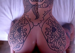 Tattooed beauty Marseline Black pleasures her man in bedroom session