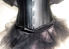 Shemale in a corset and nylons slap her penis like insane