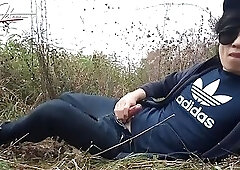 Cute gay Asian twink Jon Arteen speaks French wanks his smooth penis in the rain, lubricated with