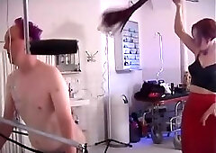 Male submissive has his ass exposed and whipped