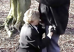 Wicked older woman with short, golden-haired hair is having sex in the car and in the forest