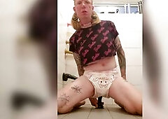 Diapered sissy enjoys large sex toy