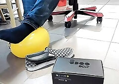 Boy Shoeplay with beach ball in Underneath Armor, Vans Slide Ons, Ebony Socks