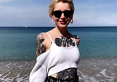Tattooed teen eats Cum after oral play on the beach