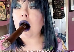 Chubby cougar Tina Snua in blue makeup smokes an Imperiales cigar. Lots of open mouth exhales and hard pulls to please you, smoking fet folk! I love t
