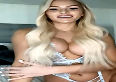 Sumptuous towheaded cougar is massaging a faux hard-on on webcam while showcasing her phat milk hooters