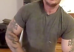 tattooed muscular hunk stroking off his big cock