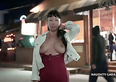 Confident brunette MILF exposes herself on the beach and in public spaces