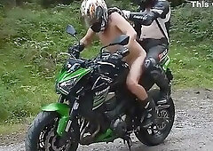 Two Muscular Guys On A Green Motorcycle
