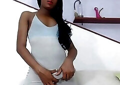 Lavish ebony shemale teases with her monster dong before masturbation