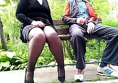 Naughty BBW milf in pantyhose and high heels gives an amateur handjob on a park bench