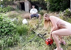 That babe arrives in 6-inch heels and a small bikini, willing to trim the grass… or at least try. This babe struggles with the gas-powered tool, pul