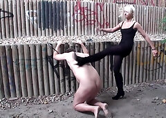 Kicking her slave outdoors by Femdom Austria