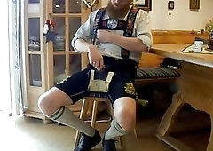 Kinky bastard pulls his dick out of lederhosen for masturbation