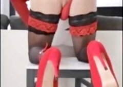 Red high-heeled slippers and g-string tease in the chair