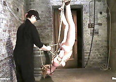 Blonde takes inverted hogtie suspension