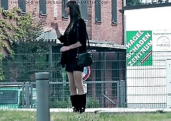 Crossdresser shemale in short petticoat and boots outside