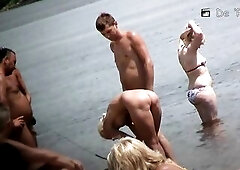 A pair of nudist sweethearts showing all they got to a hidden voyeur spy webcam as they tan and put lotion on their melons at the beach