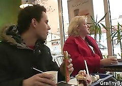 Young guy picks up huge old grandma in cafe