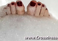 Sensual shemale takes a bath to tease with her toes
