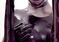 Fetish she-male in latex suit and mask plumbs