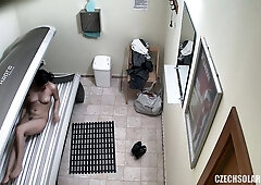 Brunette Hot Babe Relaxing in Solarium