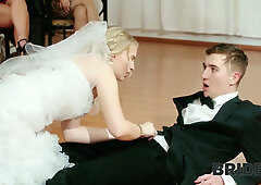 Czech blonde bride in lace stockings cheats on her groom during the wedding reception while a guest secretly watches from the doorway