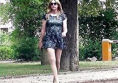 t-girl wears mini-suit and high heels