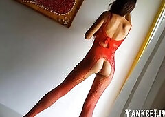 A sexy brunette solo female performer showcases her kinky side in a red-themed photo session. She teases with anal play, using a red butt plug, combin