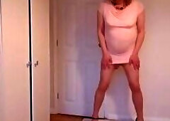 Pink minidress, nude pantyhose and black high heels